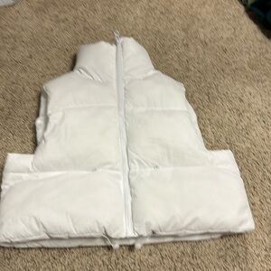 This is a simply souther puffer vest, size M/L, and it’s white.